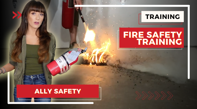 A diverse group of safety professionals and managers participate in a modern fire safety training session in a heavy industry setting, using tablets and VR headsets with a large screen displaying training content.